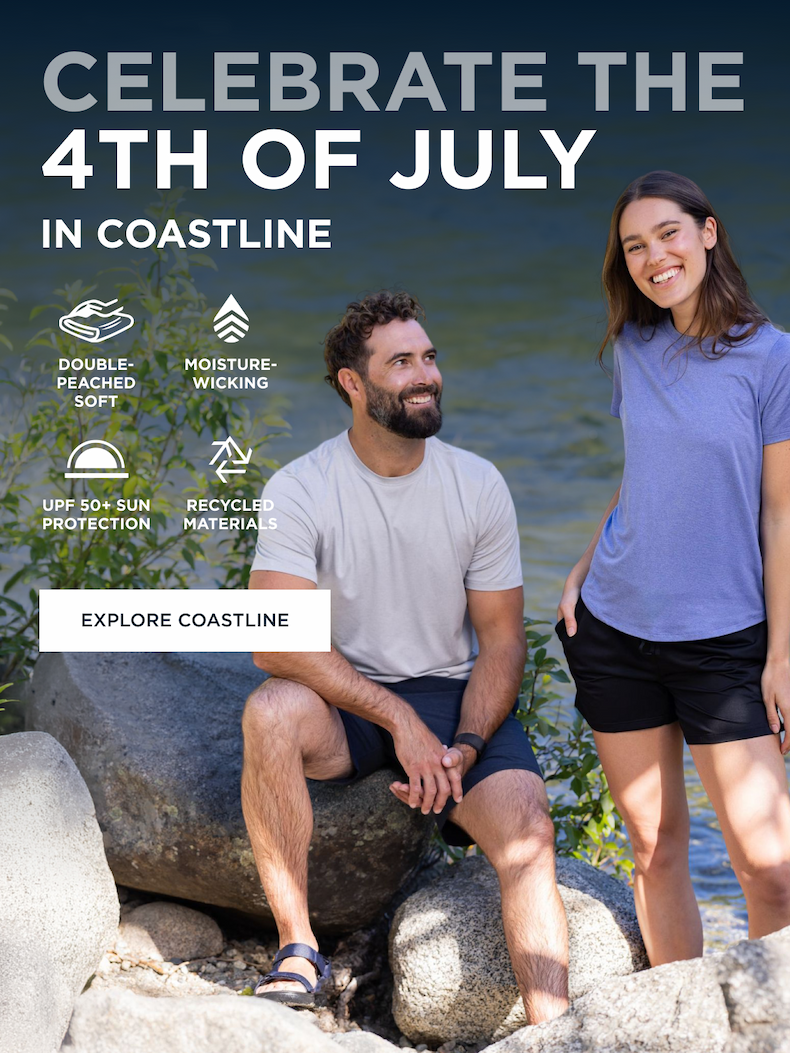 Man and Women relaxing on a lake near rocks wearing relaxed tshirt and shorts | EXPLORE COASTLINE
