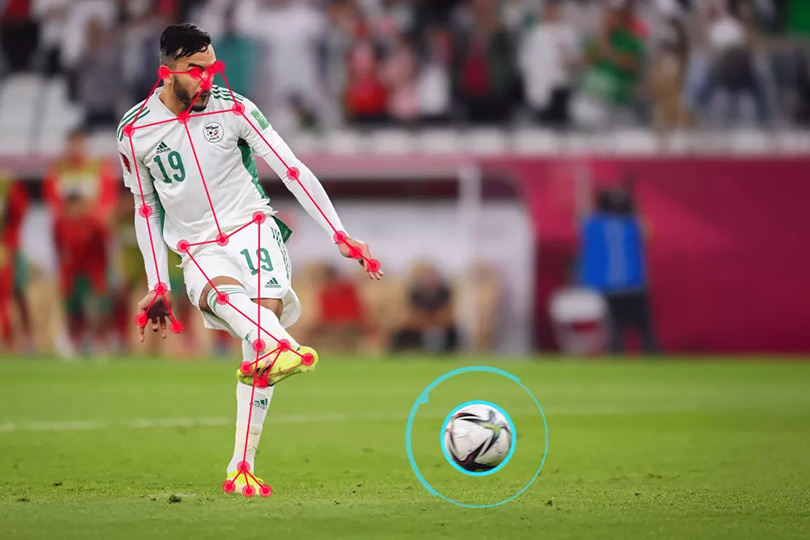 A player about to kick the ball with digital tracking overlays