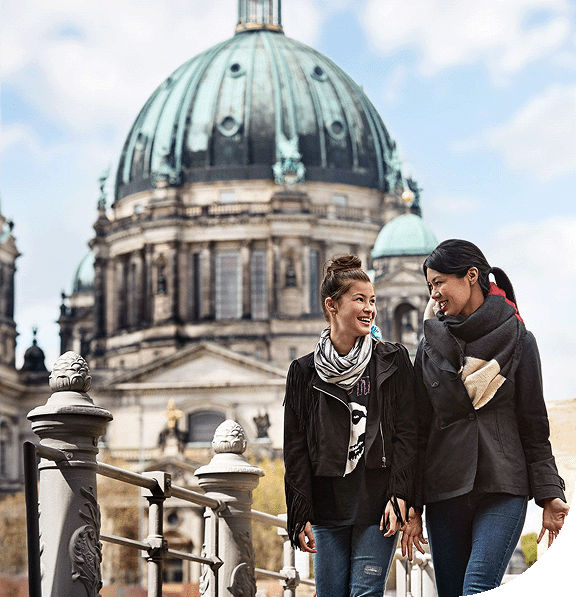 A couple walks along beautiful Berlin, Germany.