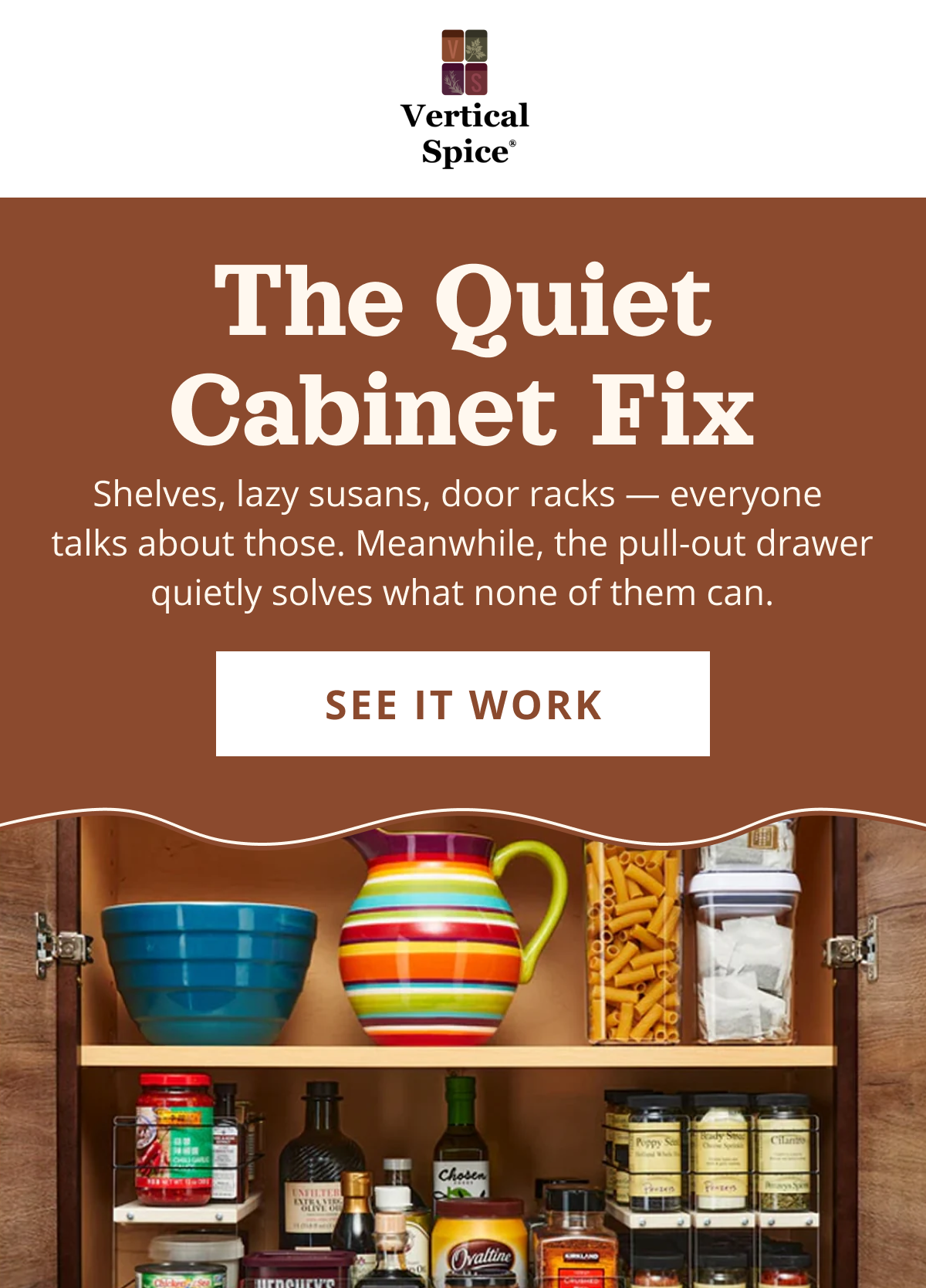 Pull-out spice rack organizer inside kitchen cabinet showing neatly arranged spice jars for easy access