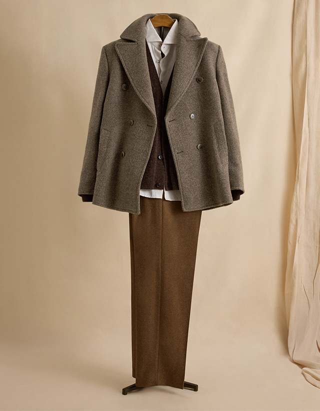 A little old school charm. Pleated trousers cut from pure wool add contrast and textural difference.