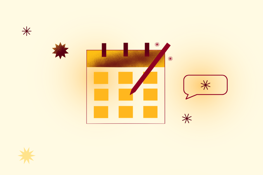 Maroon and gold calendar with a pencil writing on it.