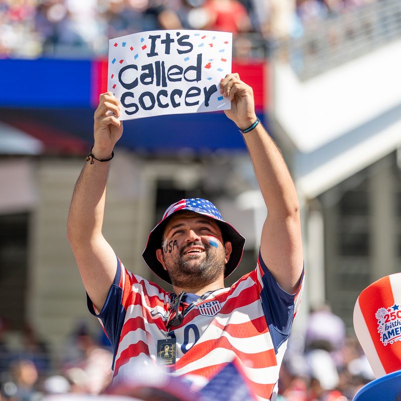 A soccer fan in a stadium.