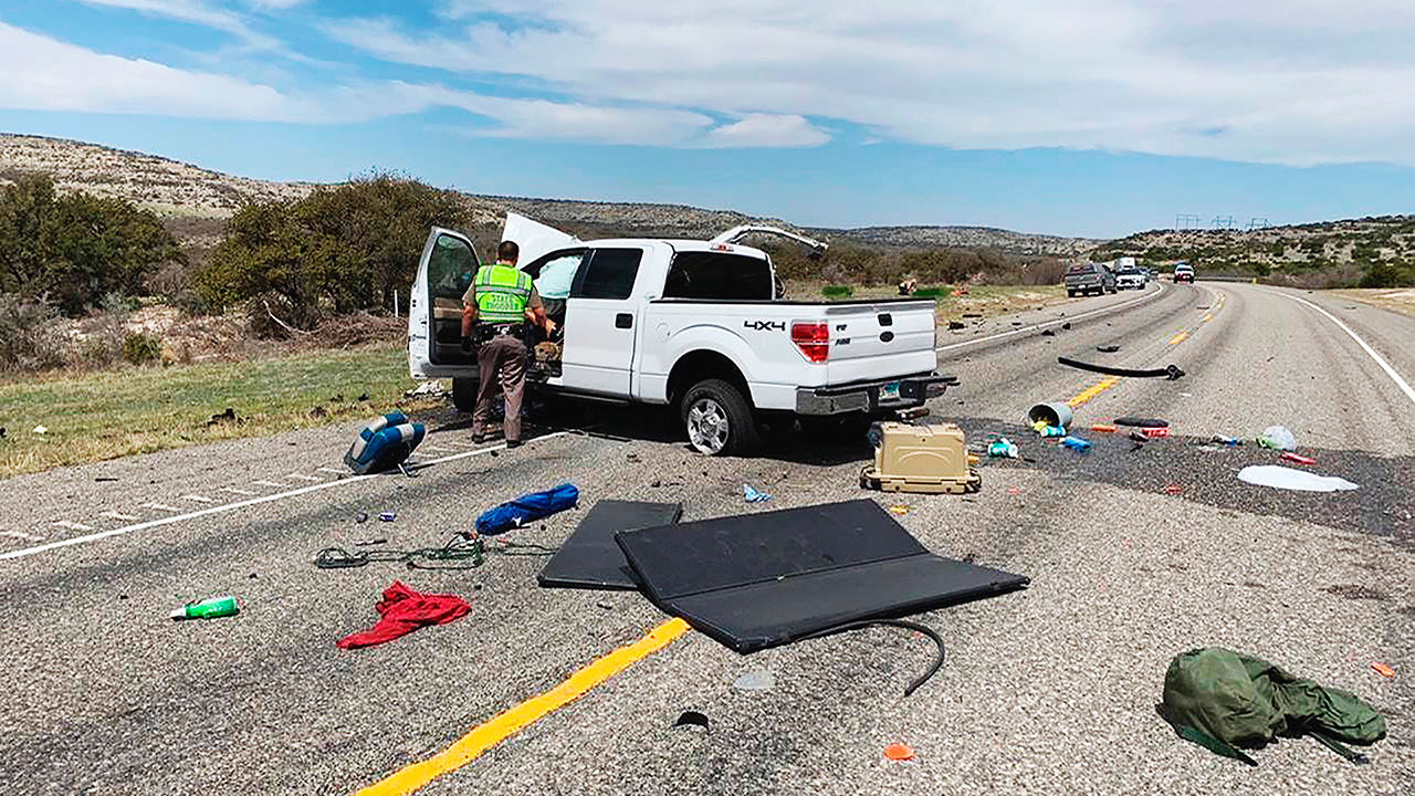 The site of a crash where a pickup truck crashed into another pickup during a police chase near the border city of Del Rio, Texas.