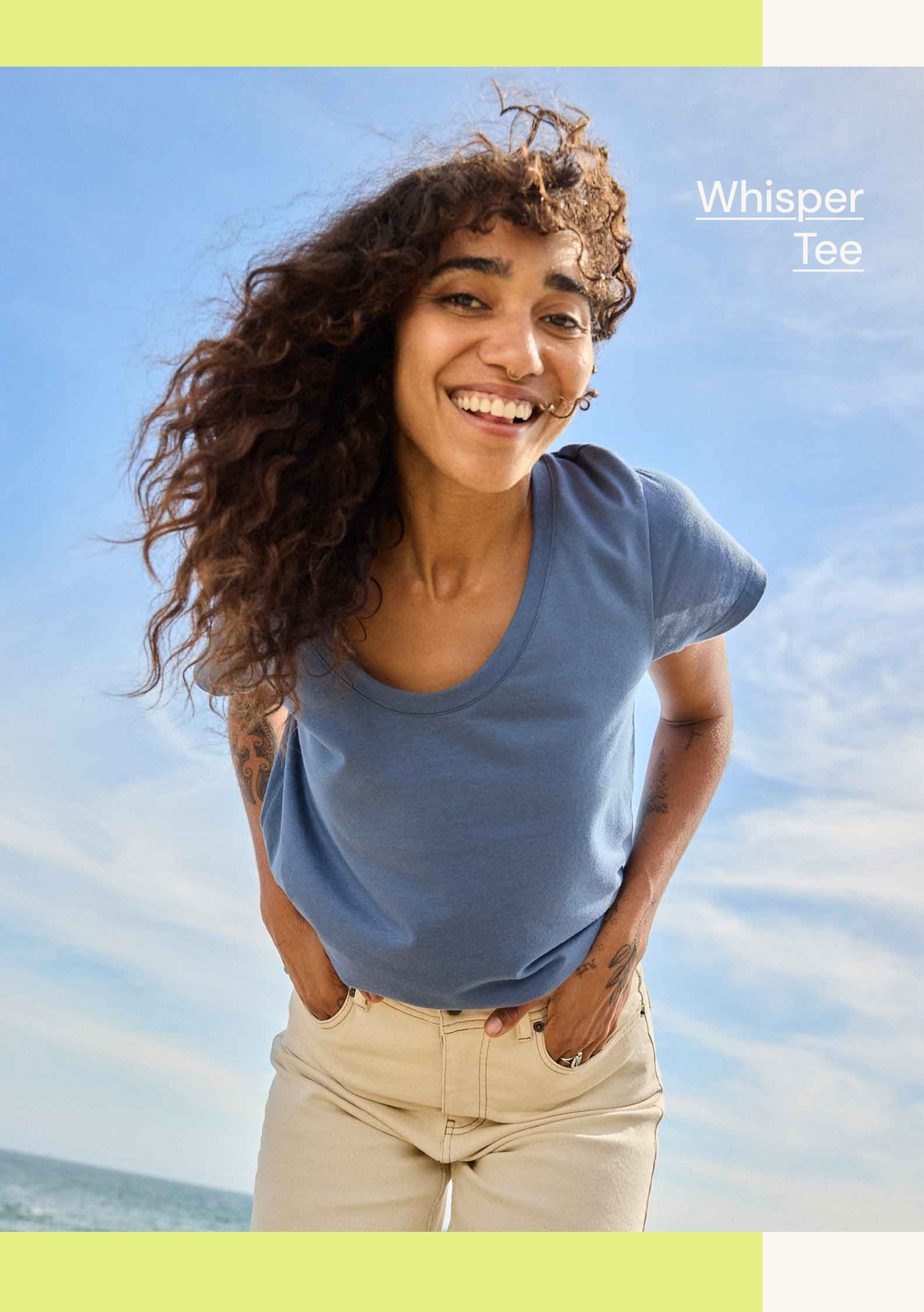 an image of a woman with curly hair smiling on the beach