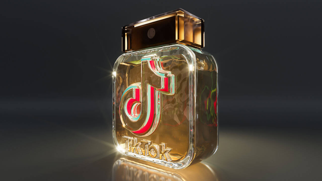 A bottle of perfume with the TikTok logo embossed