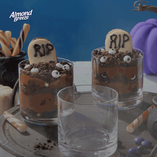 Halloween pudding cups made with Almond Breeze, topped with cookie tombstones and candy eyes.