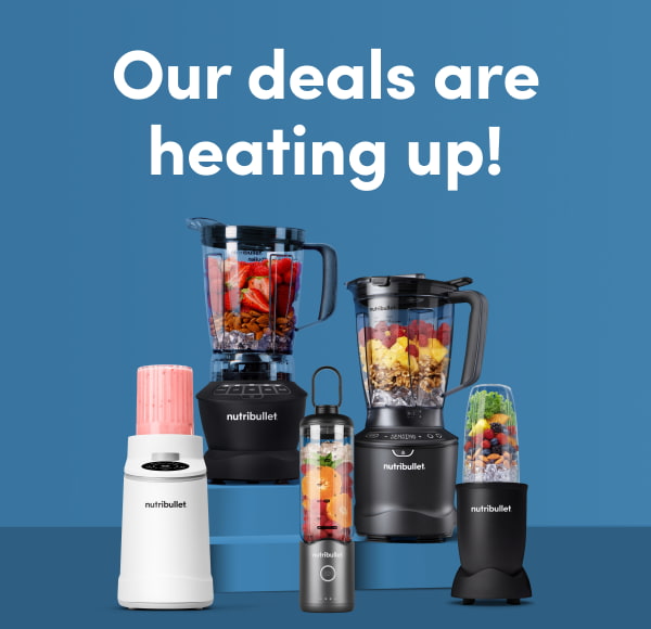 An assortment of black and white nutribullet blenders filled with fresh fruit and ice arranged against a blue background.