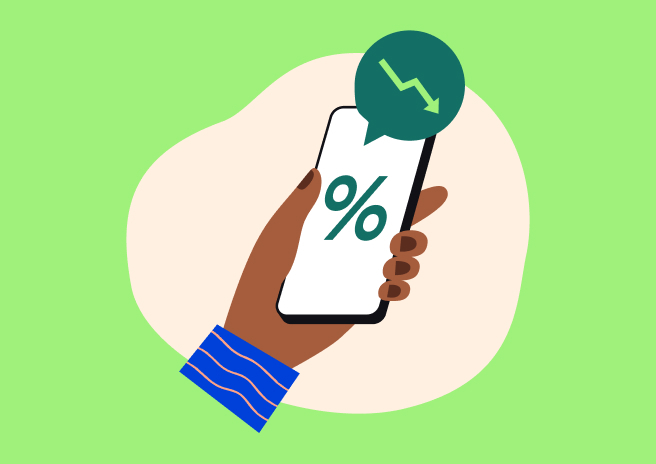 Illustration of a hand holding a smartphone with a decreasing interest rate icon.