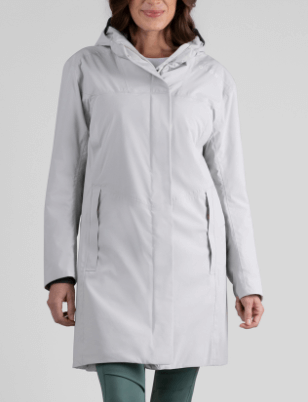 a woman wearing a white coat with a hood