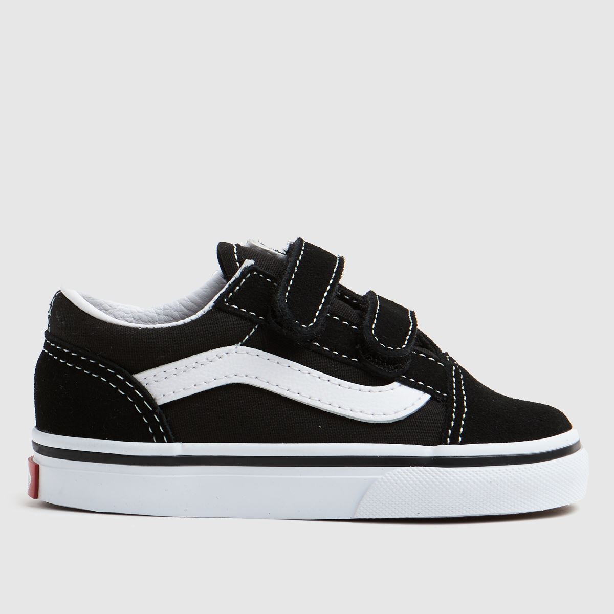 A kids' black Vans Old Skool trainer