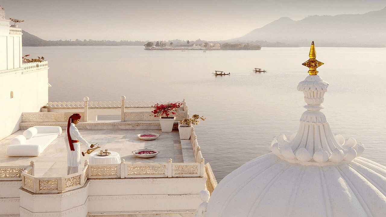 The Indian Hotels Company Limited. A view of white roofs overlooking an ocean.