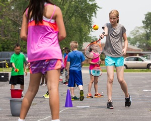 Students playing tennis