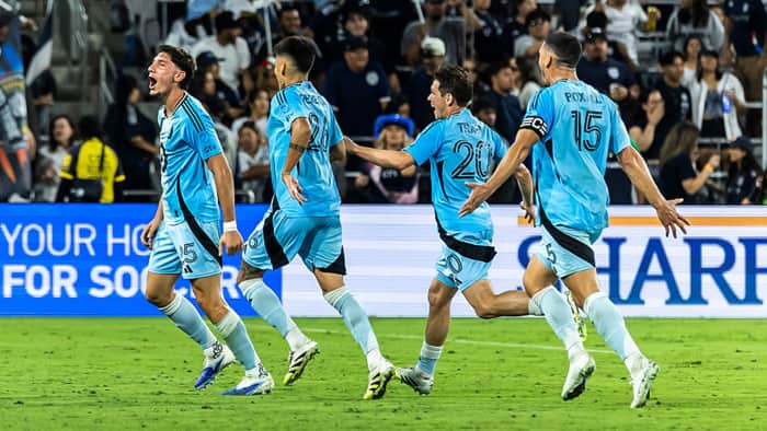 Nectarios Triantis celebrates with teammates after scoring a banger