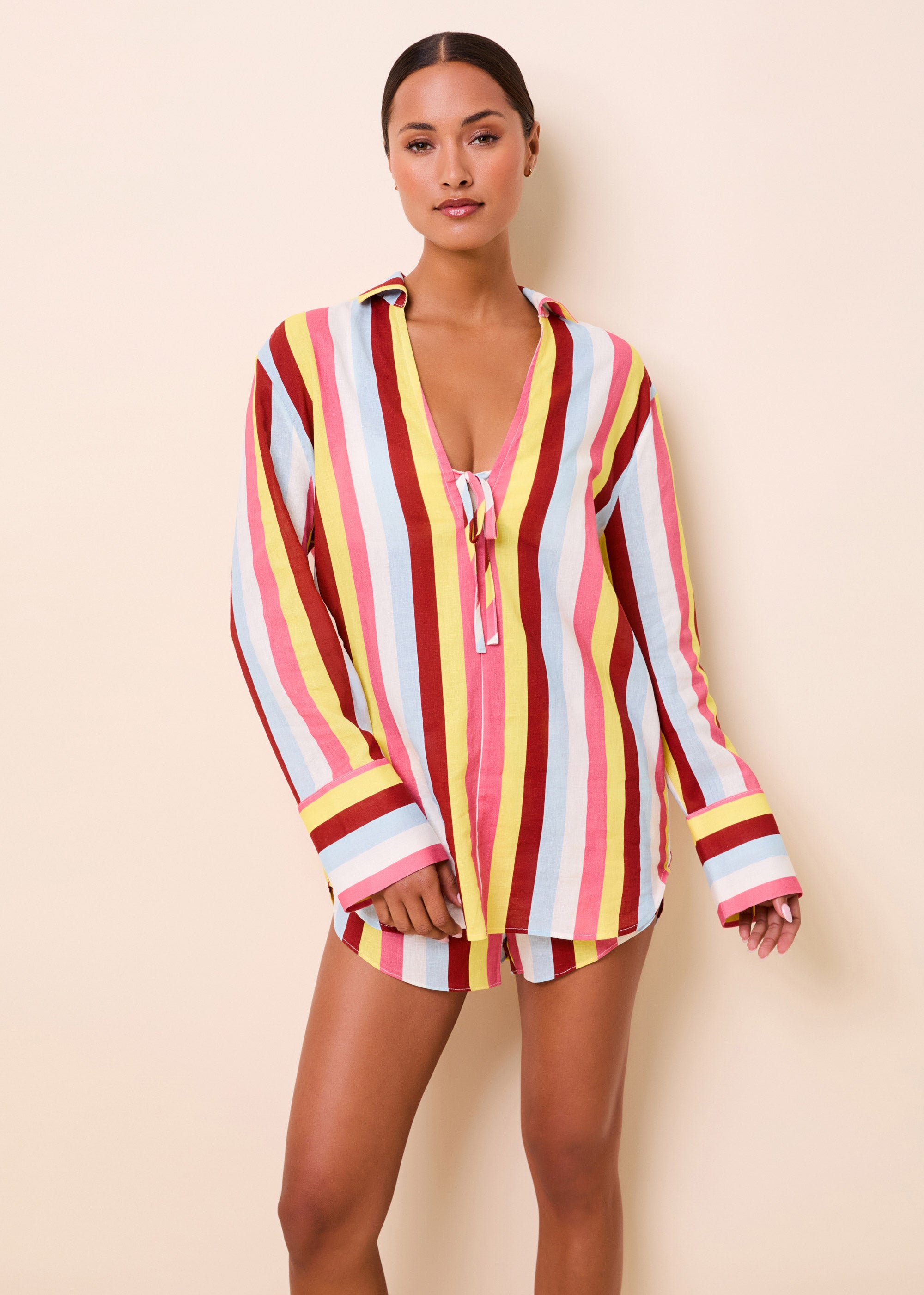 woman in long sleeve colorful stripe tie front tunic