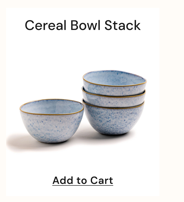 Stack of four blue cereal bowls with a gold rim.