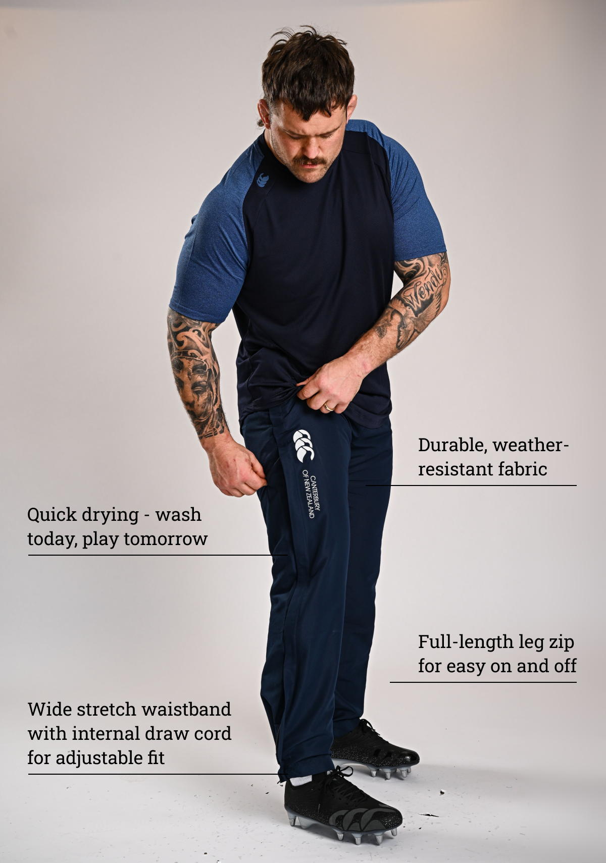 Mens Open Hem Stadium Pant Navy. Durable, weather resistant fabric. Quick drying - wash today, play tomorrow. full length leg zip for easy on and off. wide stretch waistband with internal draw cor for adjustable fit.