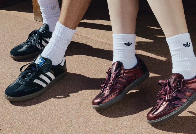 A red and black pair of Samba shoes.