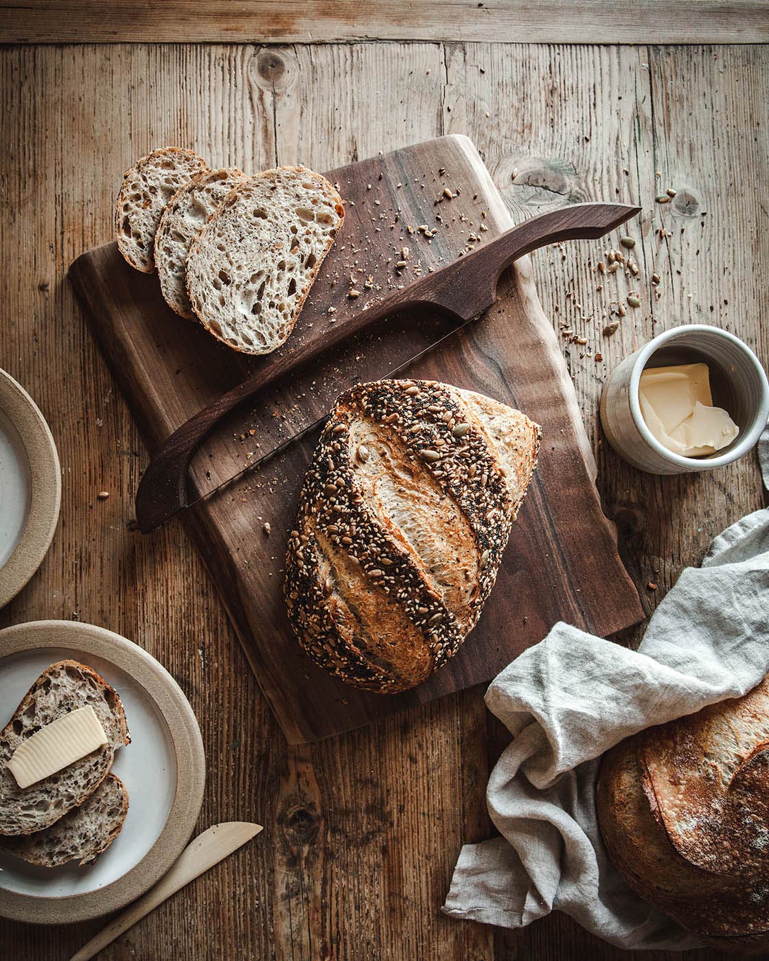 The Pantry Bread Bow holding a loaf of bread