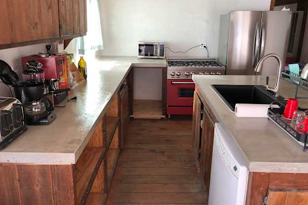 The Most Stunning Green Cabinets Gave a Dated Kitchen a Mid-Century Makeover