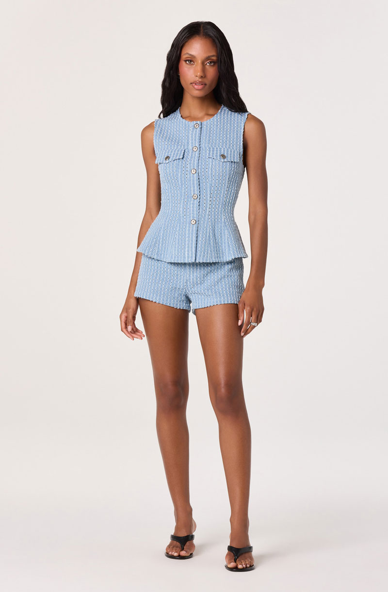 Woman Wearing Denim Peplum Vest