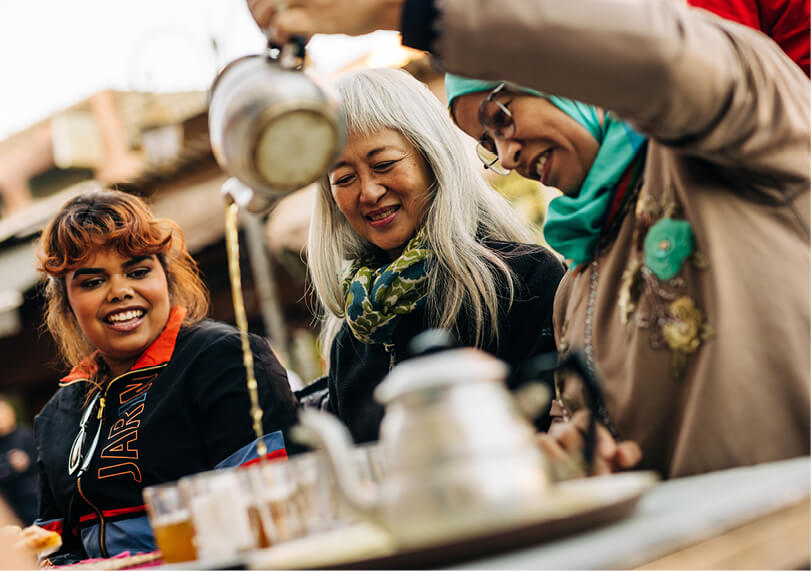 Three women drinking tea