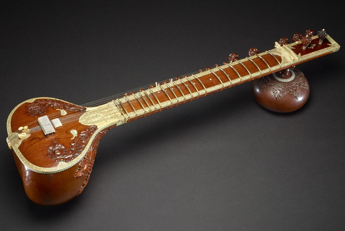 A sitar against a dark background.