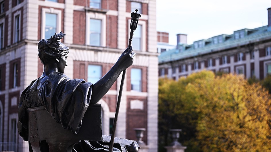 Alma Mater statue with Kent Hall in the background
