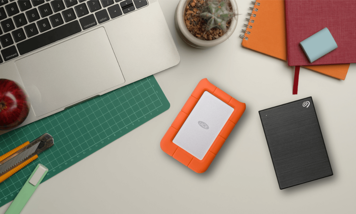A laptop with Seagate portable hard drives, illustrating ideal storage solutions for students preparing for back to school.