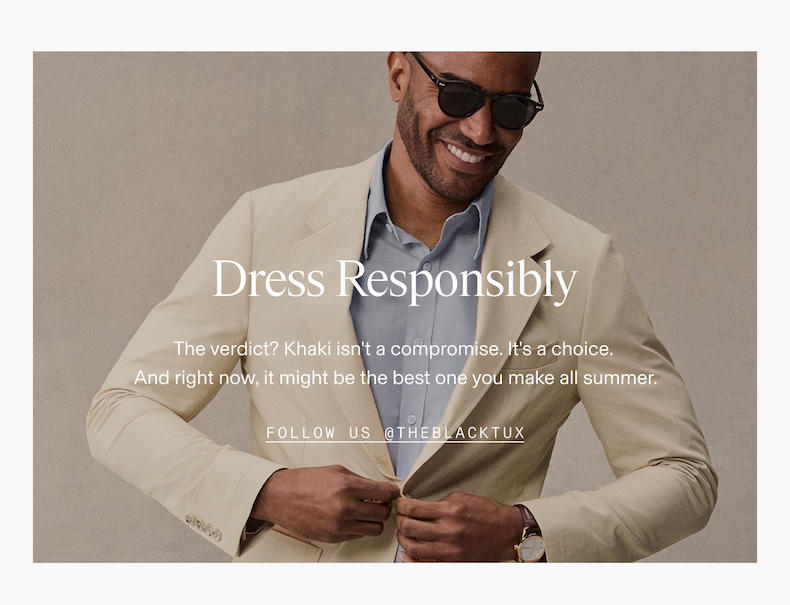 Man smiling and adjusting his khaki blazer over a light blue dress shirt, wearing sunglasses. Dress Responsibly. The verdict? Khaki isn't a compromise. It's a choice. And right now, it might be the best one you make all summer. FOLLOW US @THEBLACKTUX