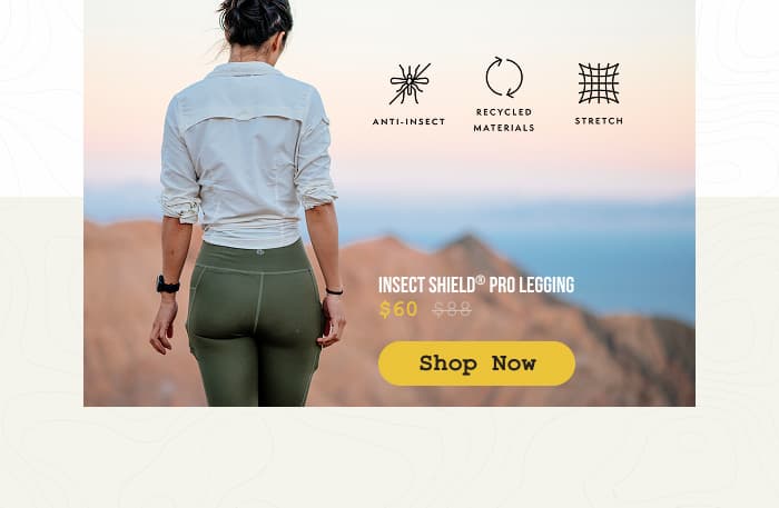 Photo of a woman, standing with her back turned to the camera, in the desert, while wearing Insect Shield Pro Leggings