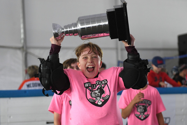 ICE District kid with trophy