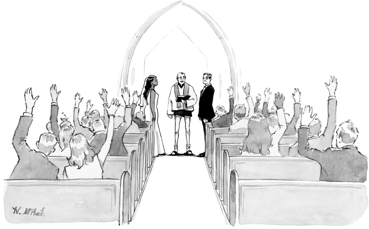 Two people stand at the alter, with a priest in shorts between them, while everyone in the audience has raised hands.