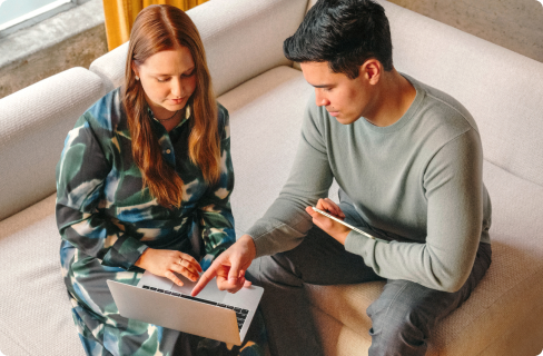 Photo-of-two-coworkers-talking-over-tablet