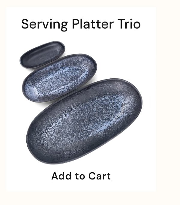 Three oval serving platters in varying sizes with a speckled design.