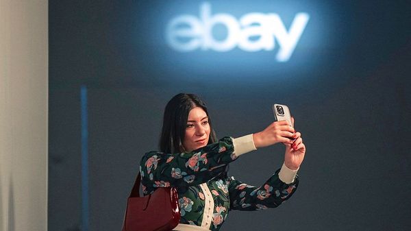 A guest takes a selfie as she arrives for the eBay Endless Runway show during New York Fashion Week