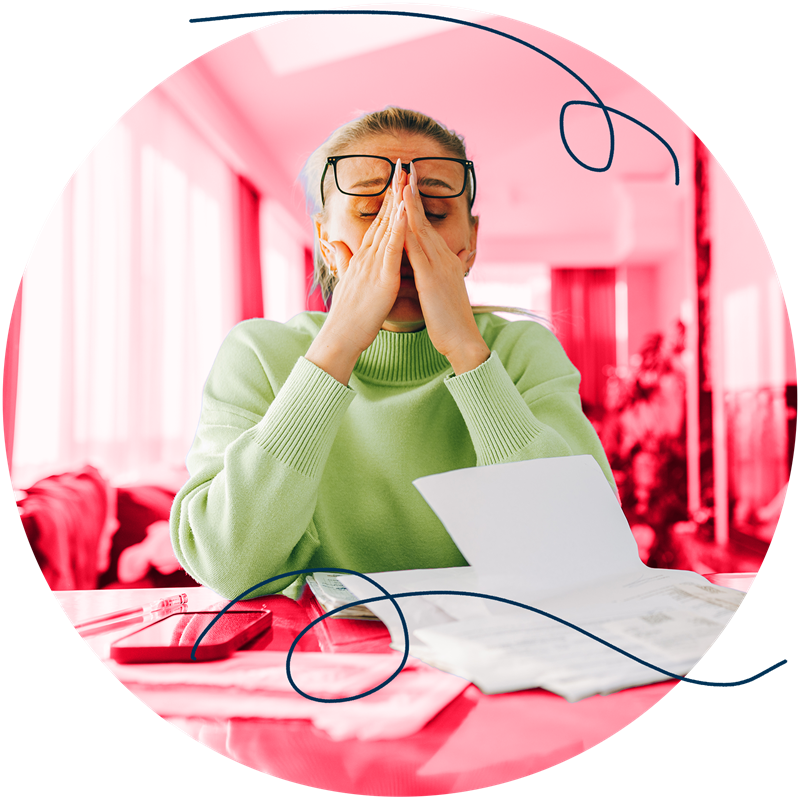 Woman doing taxes and looking stressed