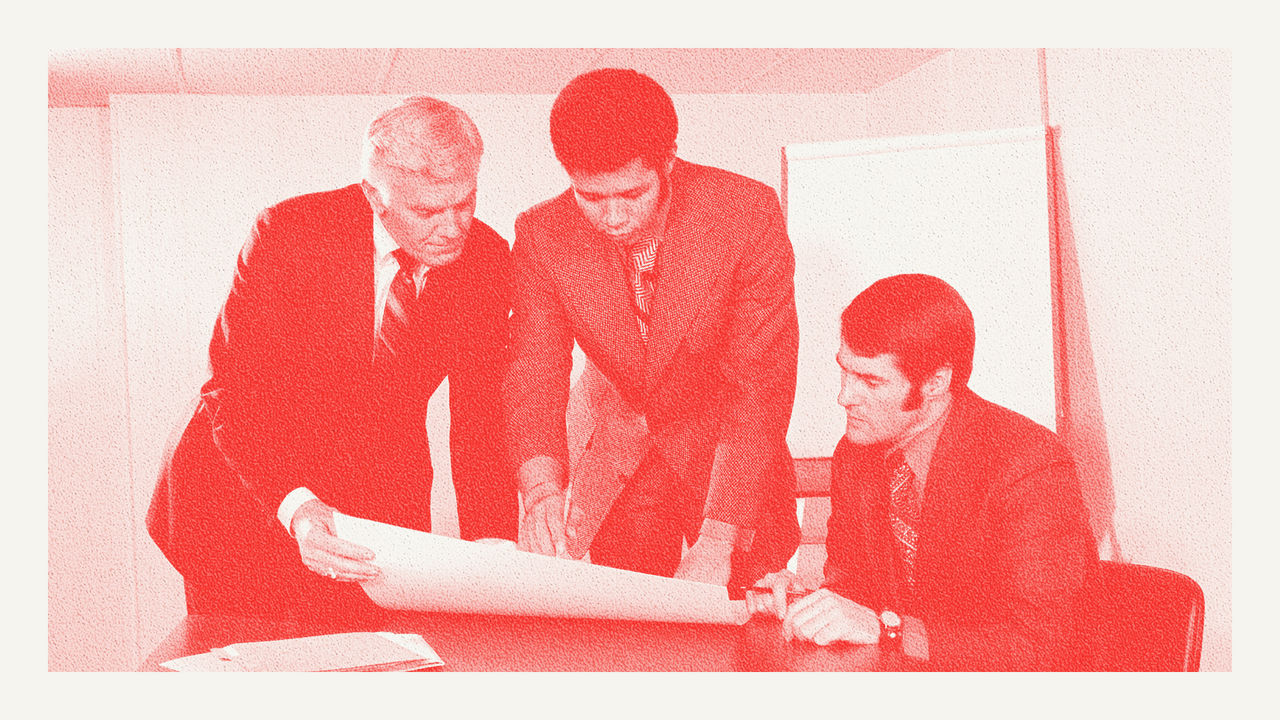 Business men in a meeting in the 1970s
