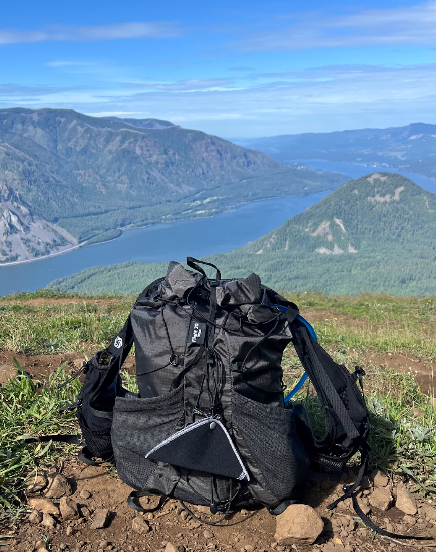 backpack in front of river view