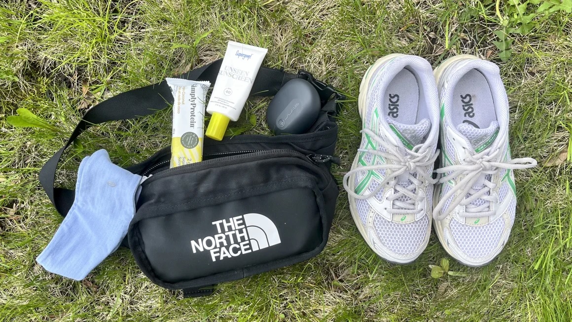 walking shoes and fanny pack against grass