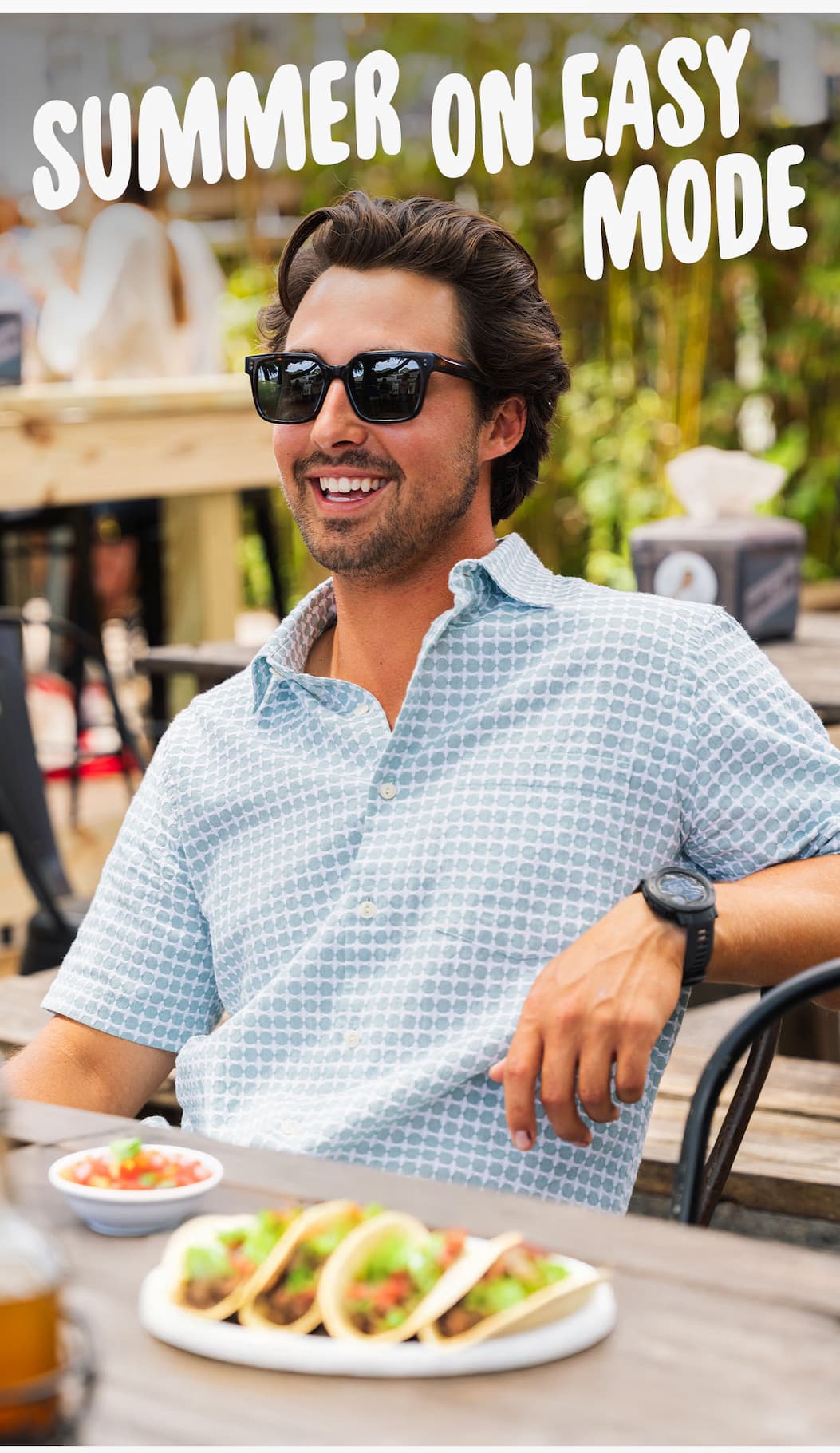 Summer on easy mode [ image of guys relaxing with some mexican food, smiling and wearing a new textured vacation shirt]
