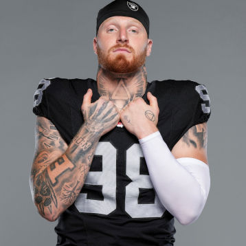 Maxx Crosby in black football uniform.