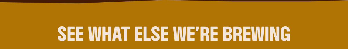 an image of a brown and white sign with a sky background