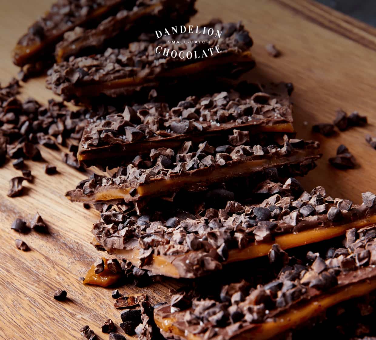 Pieces of Nibby Toffee coated in single-origin chocolate and topped with cocoa nibs. 