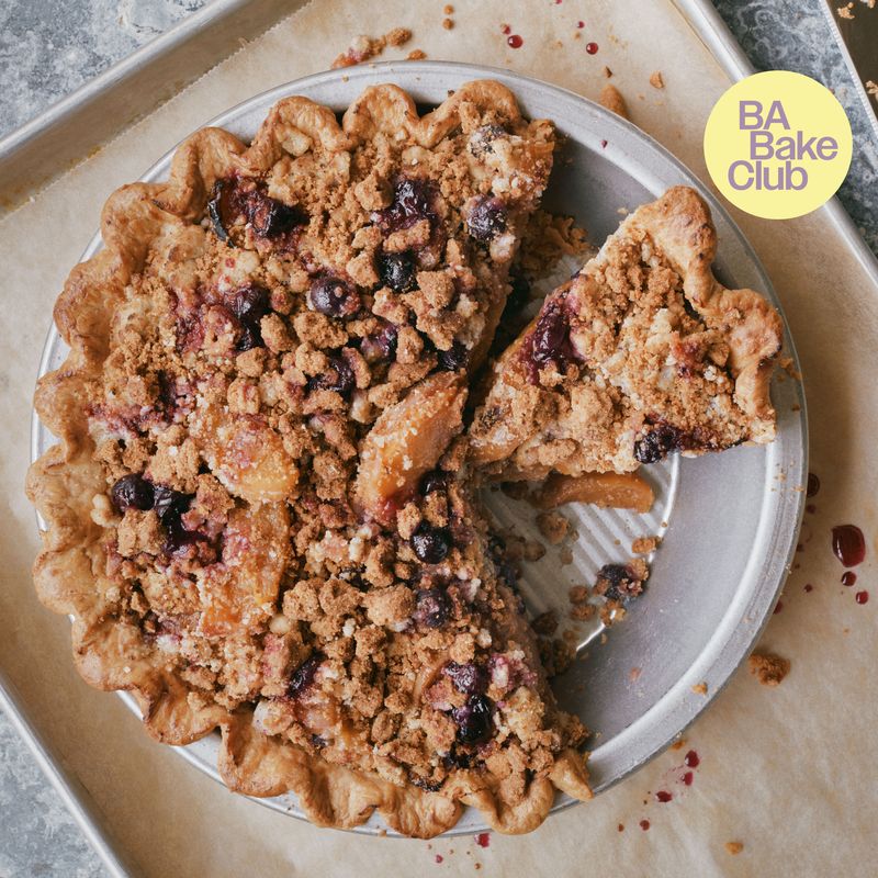 A peach and blueberry pie with a cardamom crumble topping.