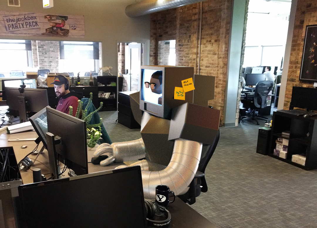 Photo of Computer costume sitting at desk in Jackvox office.