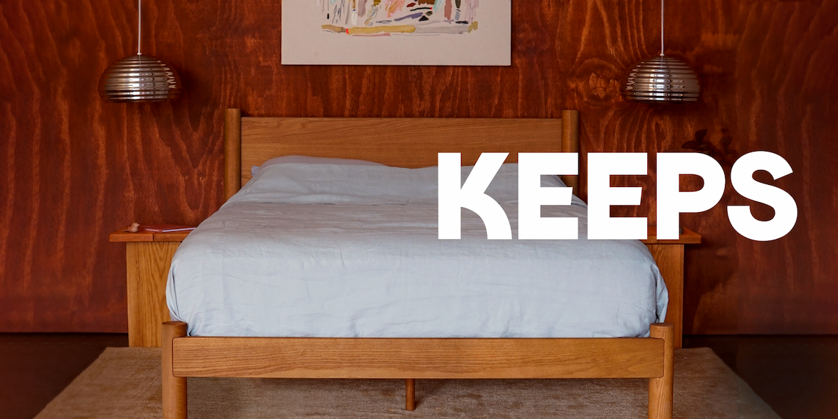 Keeps Home Architect Bed Frame in honey morning light with plant in pig vase