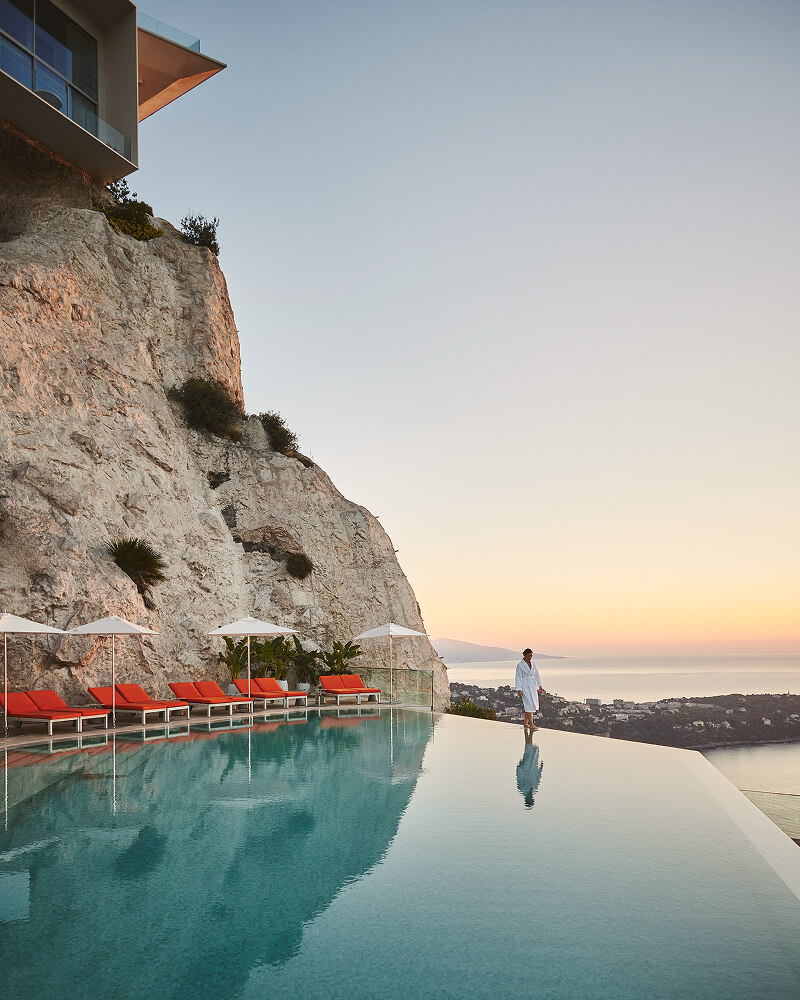 Lady in the infinity pool at The Maybourne Riviera