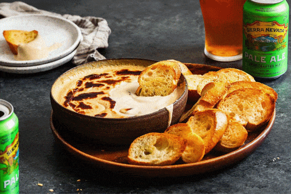 A photo slider showing beer cheese, a salad, and grilled trout