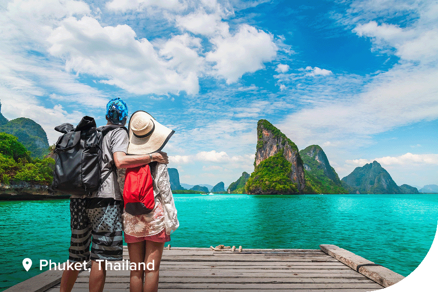 Two travellers on the shore of Phuket, Thailand.